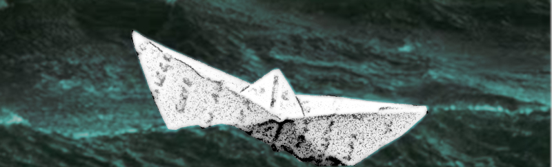 Barquito de papel en el mar